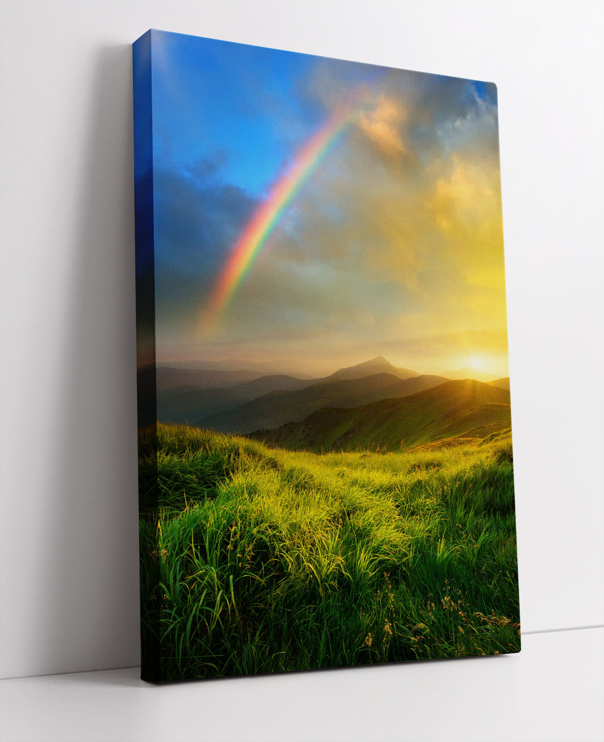 Berge mit Regenbogen am Himmel Leinwandbild Studio