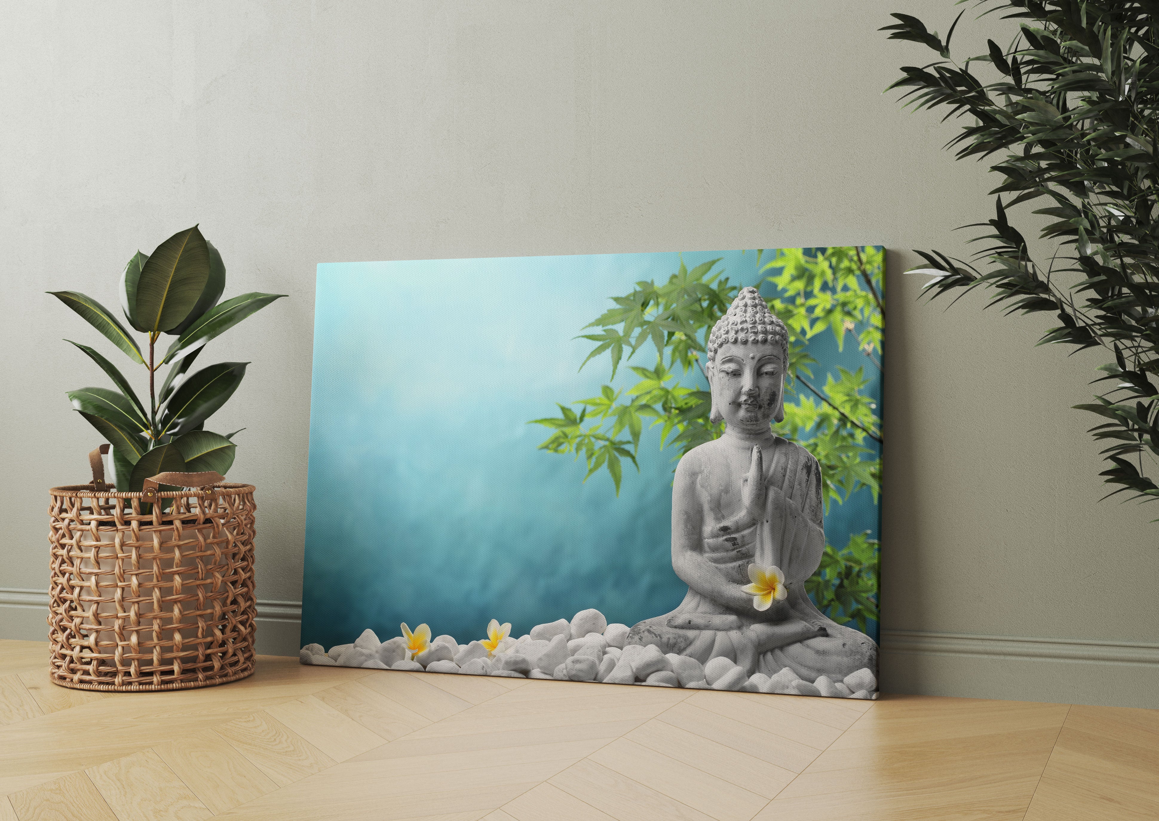 Buddha auf Steinen mit Monoi Blüte Leinwandbild Wohnzimmer