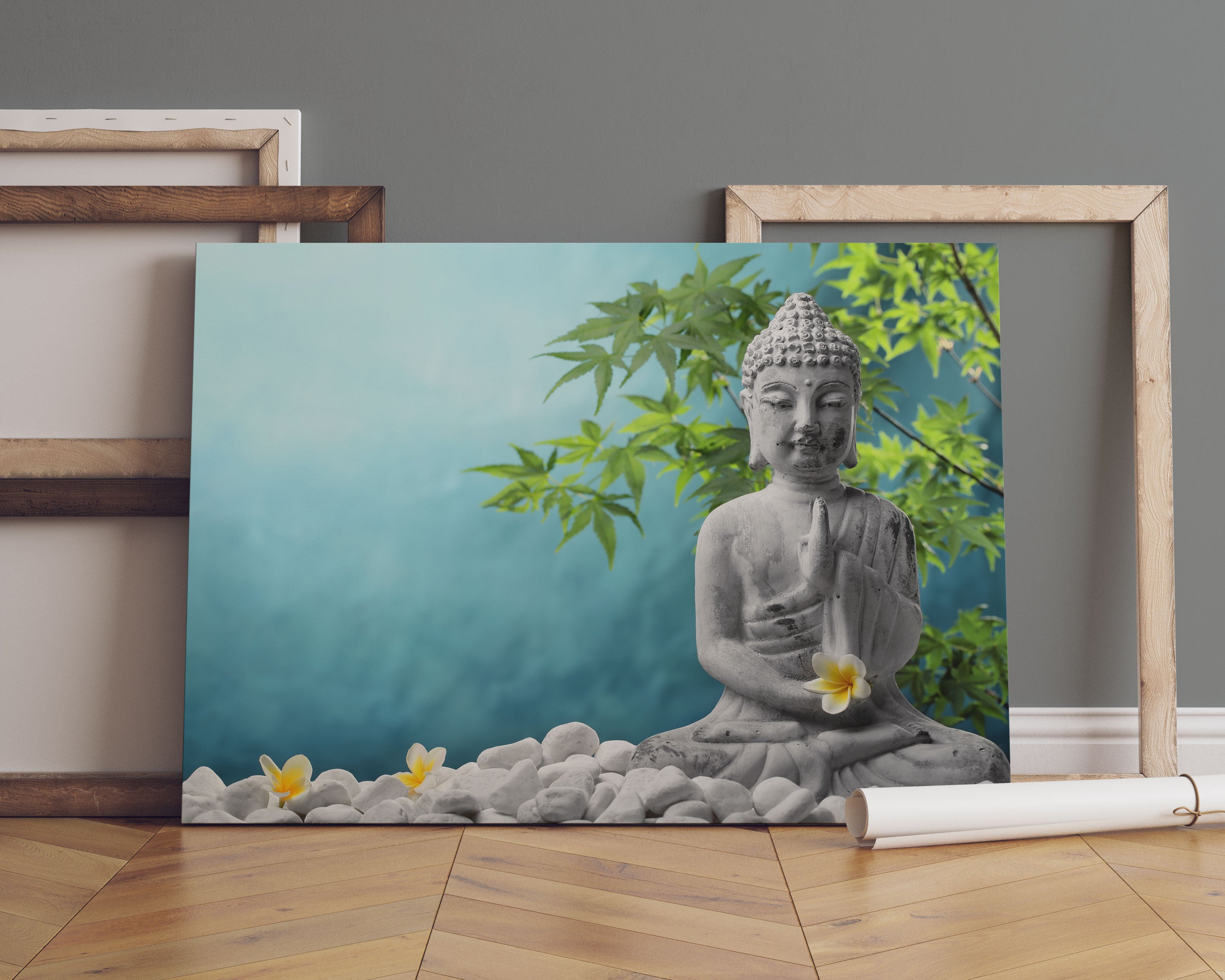 Buddha auf Steinen mit Monoi Blüte Leinwandbild Sofa