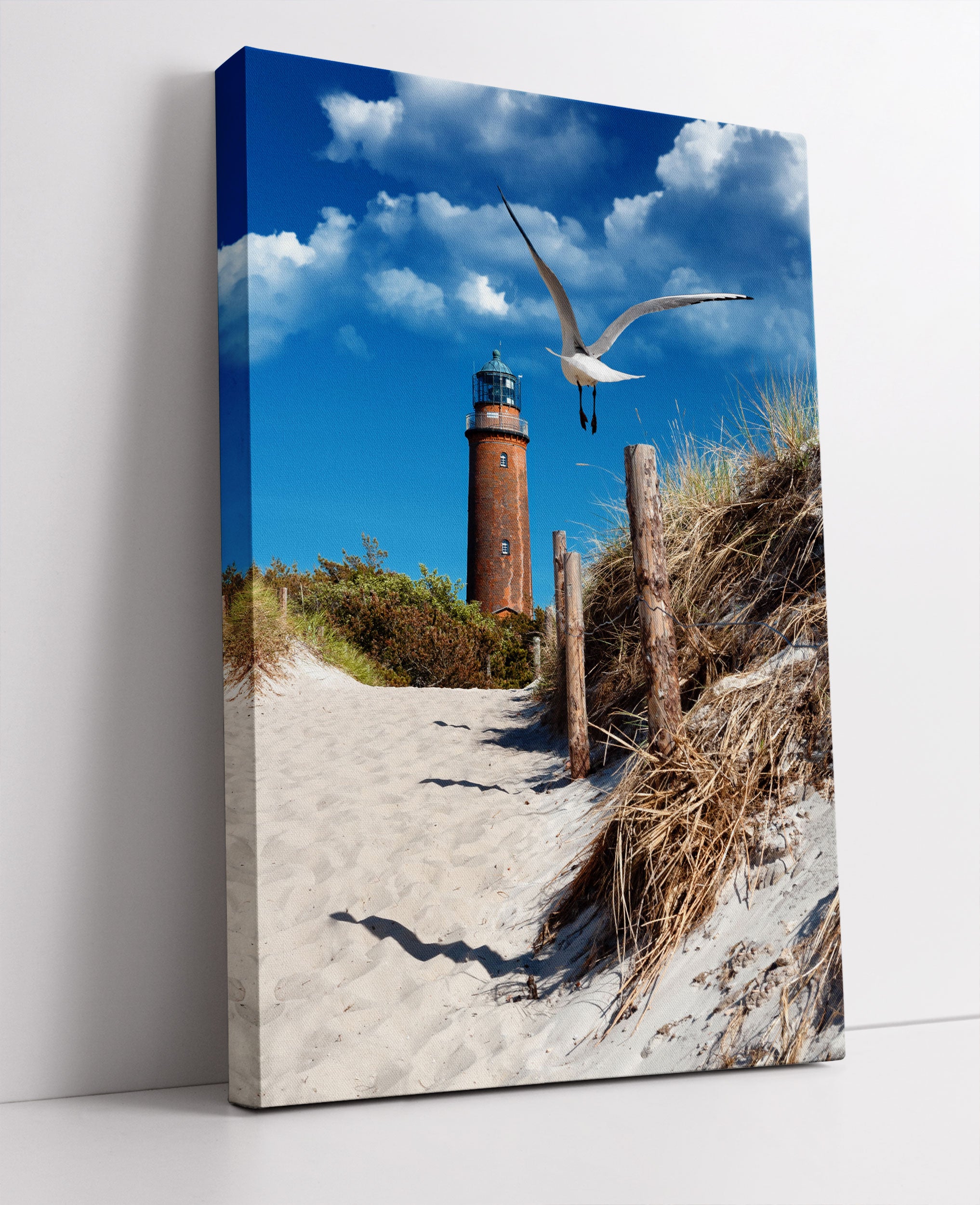 Schöner Leuchtturm am Strand Leinwandbild Studio