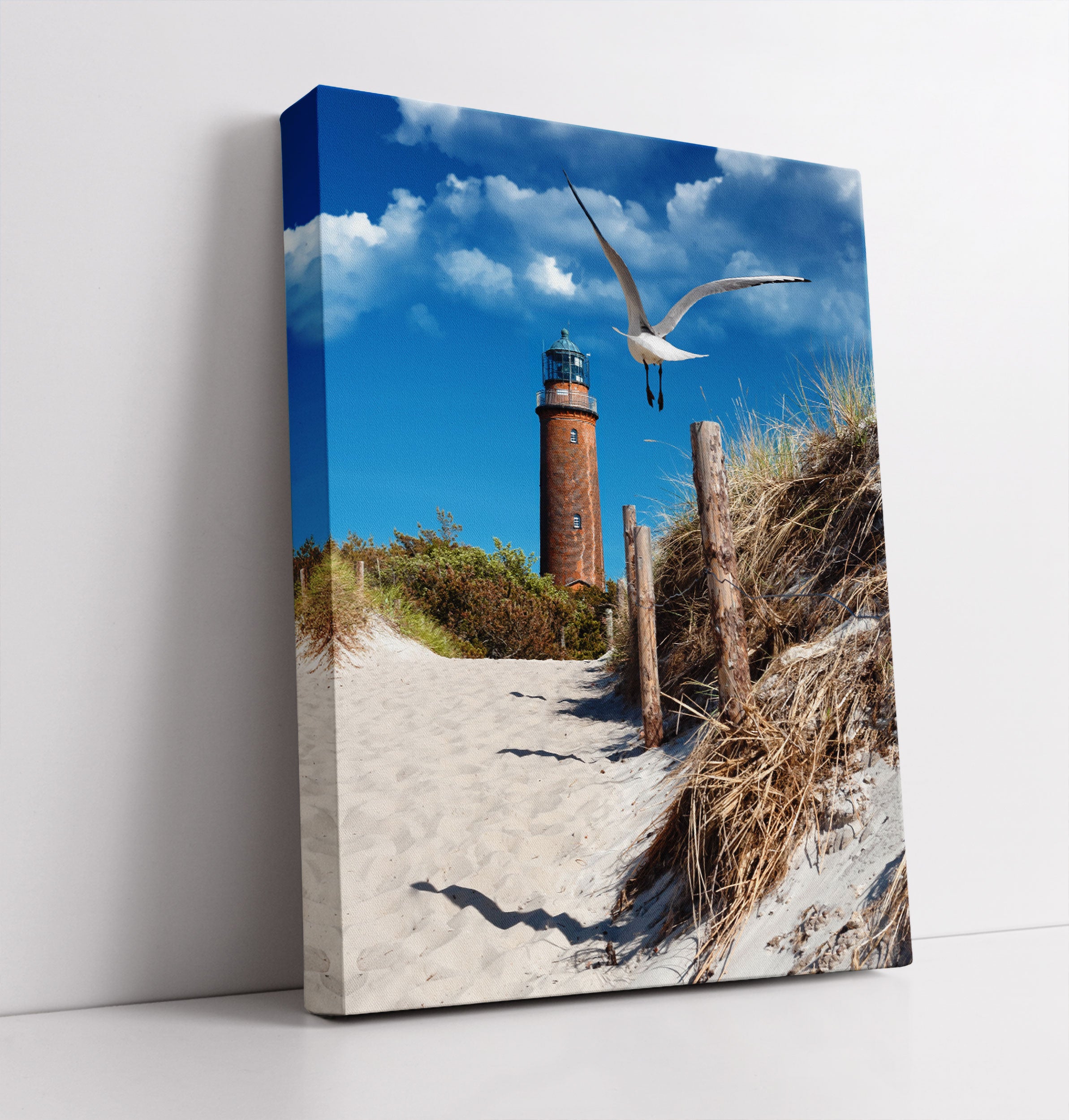 Schöner Leuchtturm am Strand - Leinwandbild