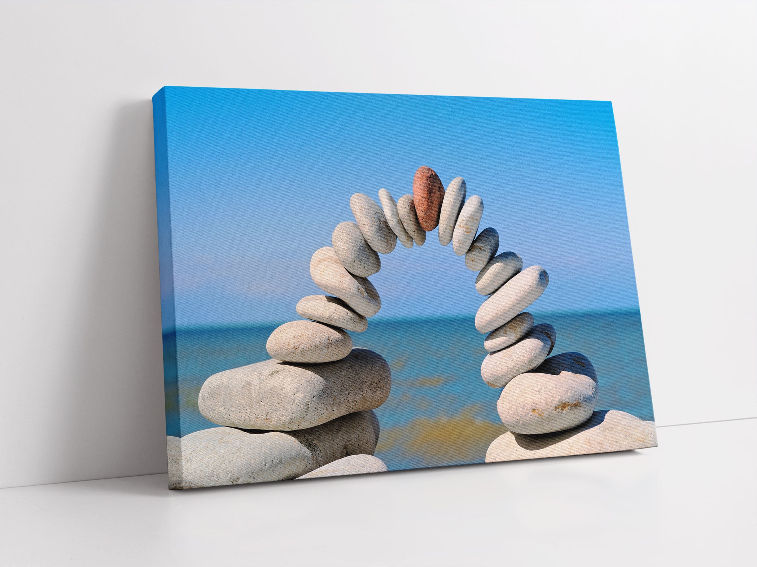 Brücke aus Zen Steinen am Meer Leinwandbild Studio