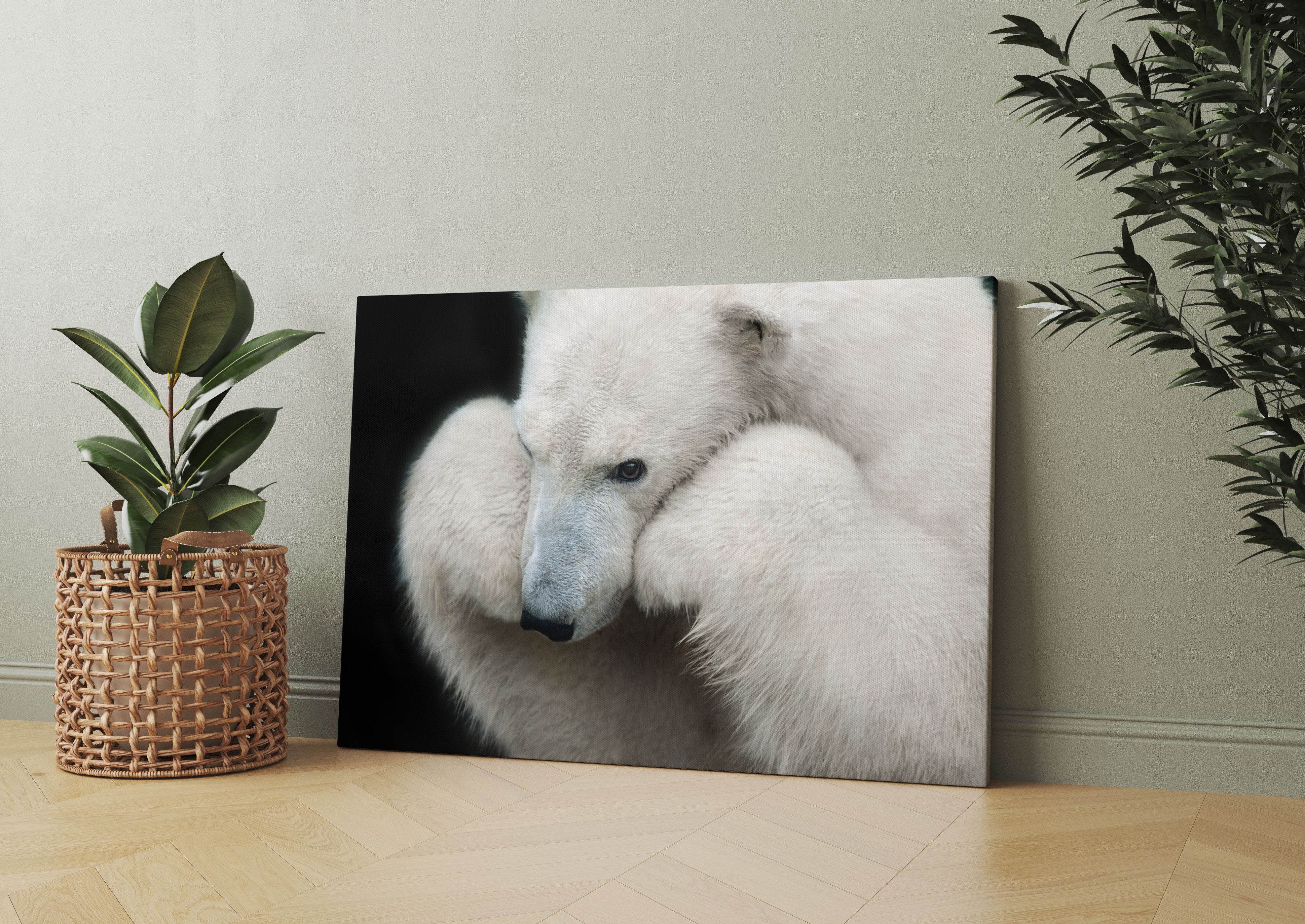 Grübelnder Eisbär stützt sich auf Pfoten Leinwandbild Wohnzimmer